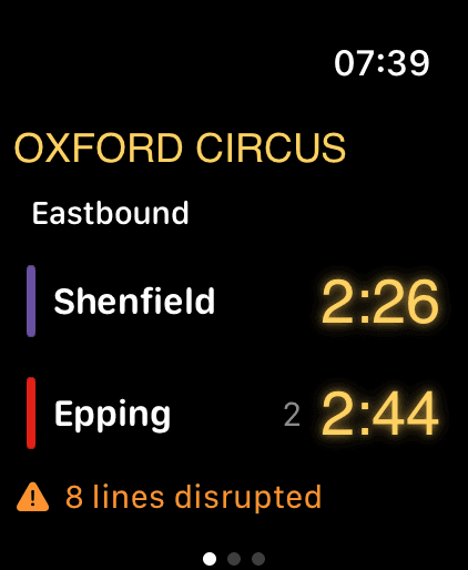 Tubbie on Apple Watch. Oxford Circus board with large eastbound countdowns to Shenfield and Epping, and an eight-lines-disrupted warning.